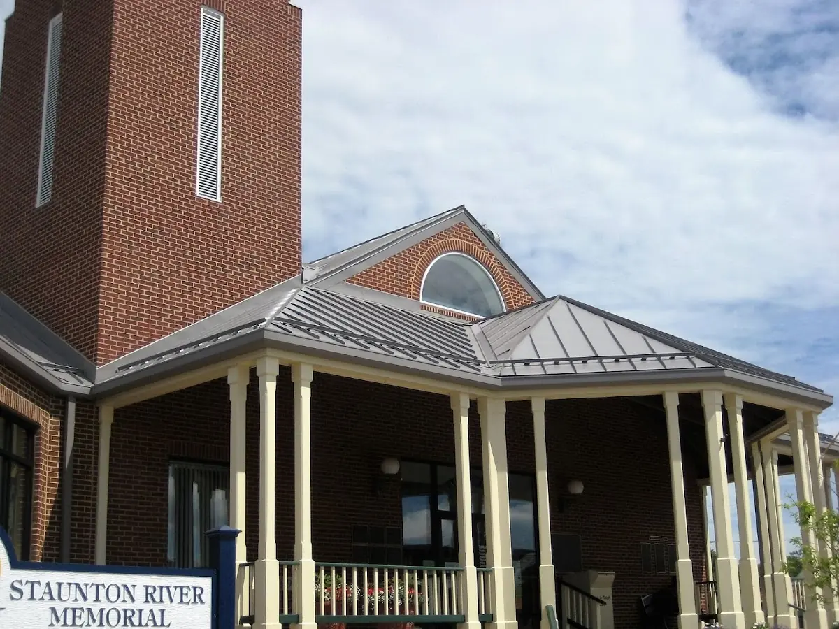 Skilled roofing craftsmen working on a residential roof in Pensacola Station